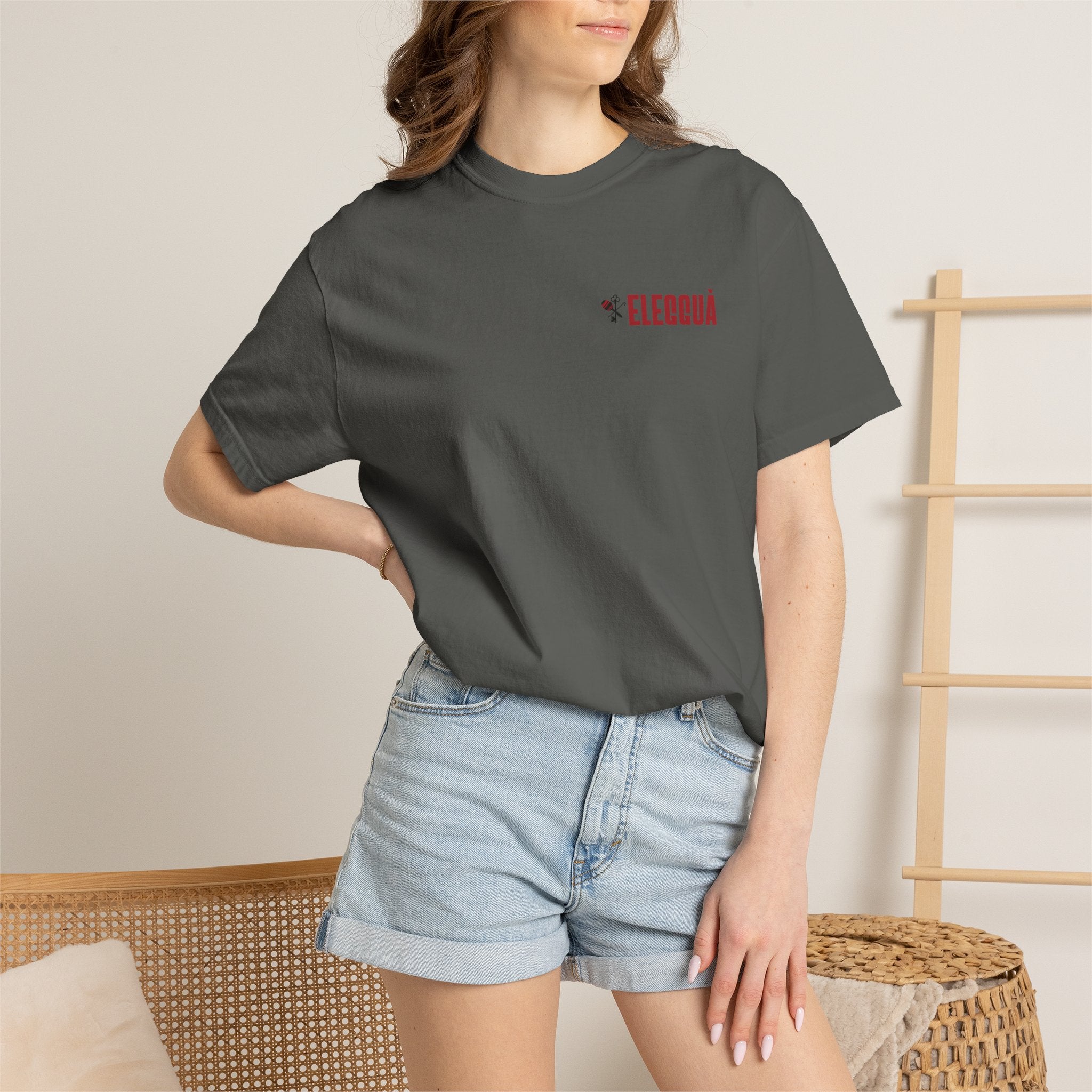 Elegguà T-Shirt — Afro Child Illustration Tee with Repeated Text Back Print