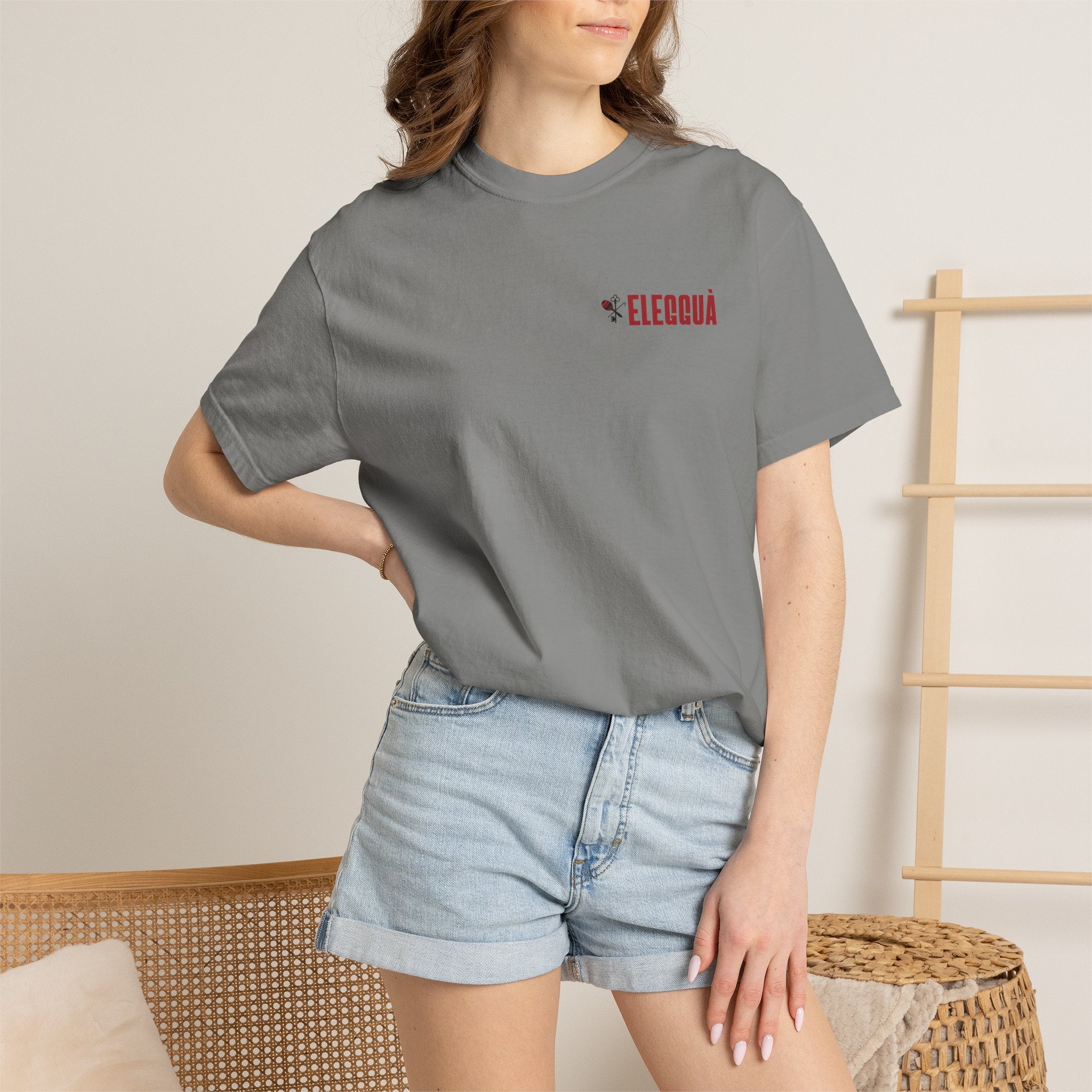 Elegguà T-Shirt — Afro Child Illustration Tee with Repeated Text Back Print