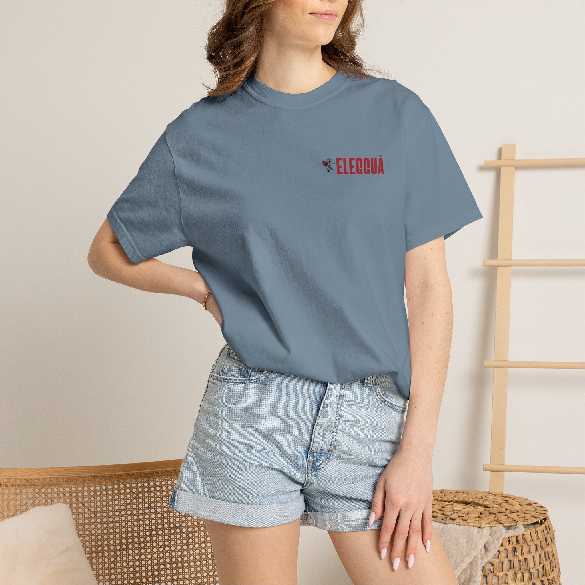 Elegguà T-Shirt — Afro Child Illustration Tee with Repeated Text Back Print